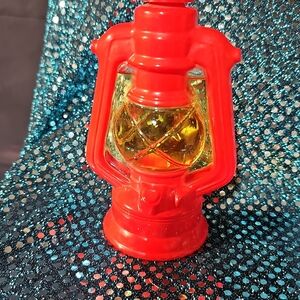 A008. 1970 Avon Red Lantern with Yellow Glass Accent